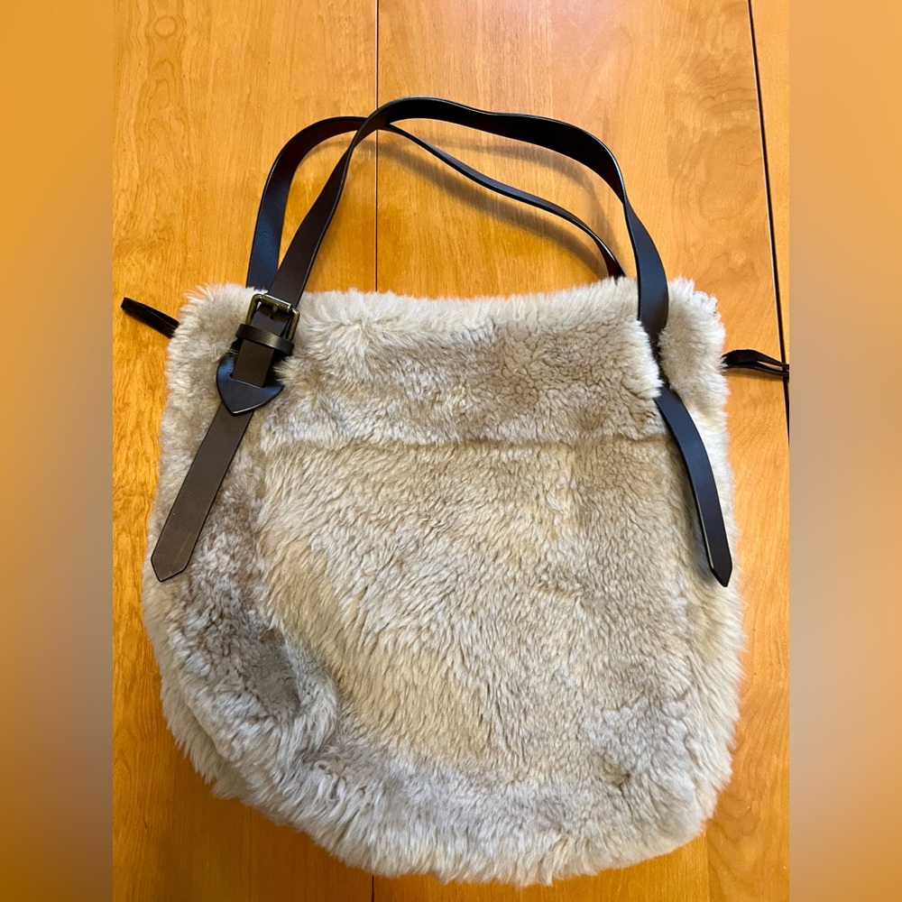 Anthropologie large faux fur tote
Leather adjustable straps